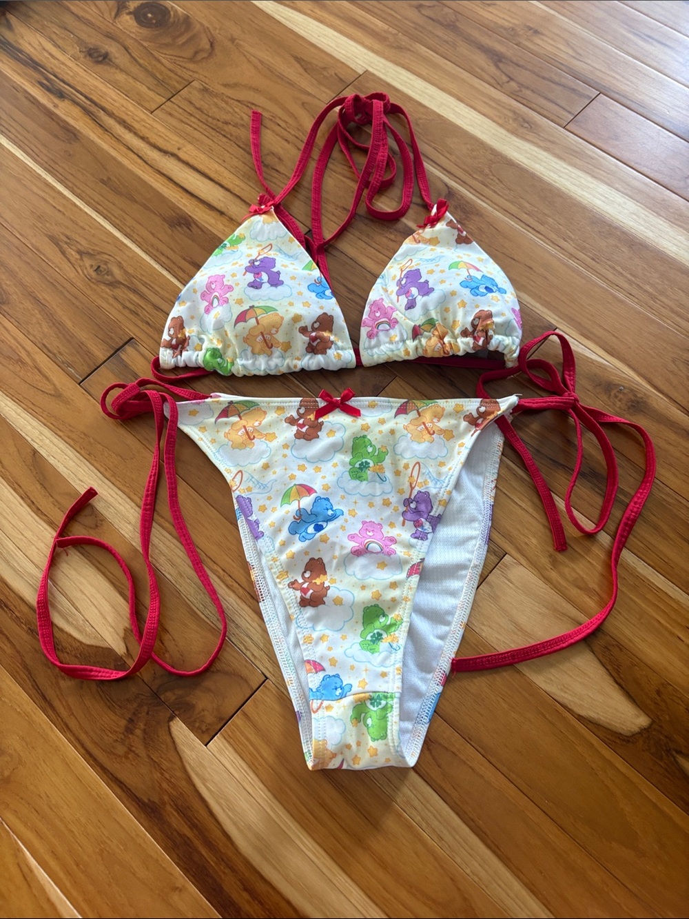 Woman’s Red-Trim Two-Piece Swim Set with Colorful Carebear  Print